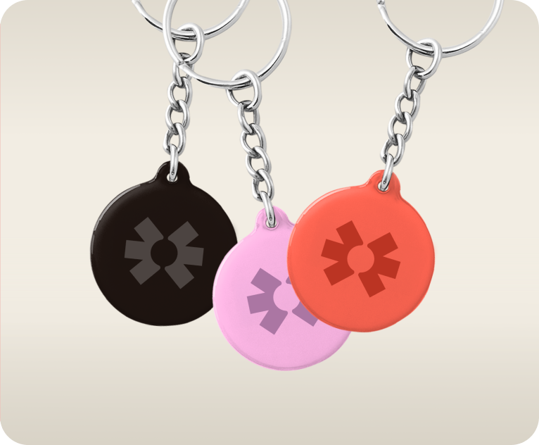 Blinq NFC keychains in black, pink and coral