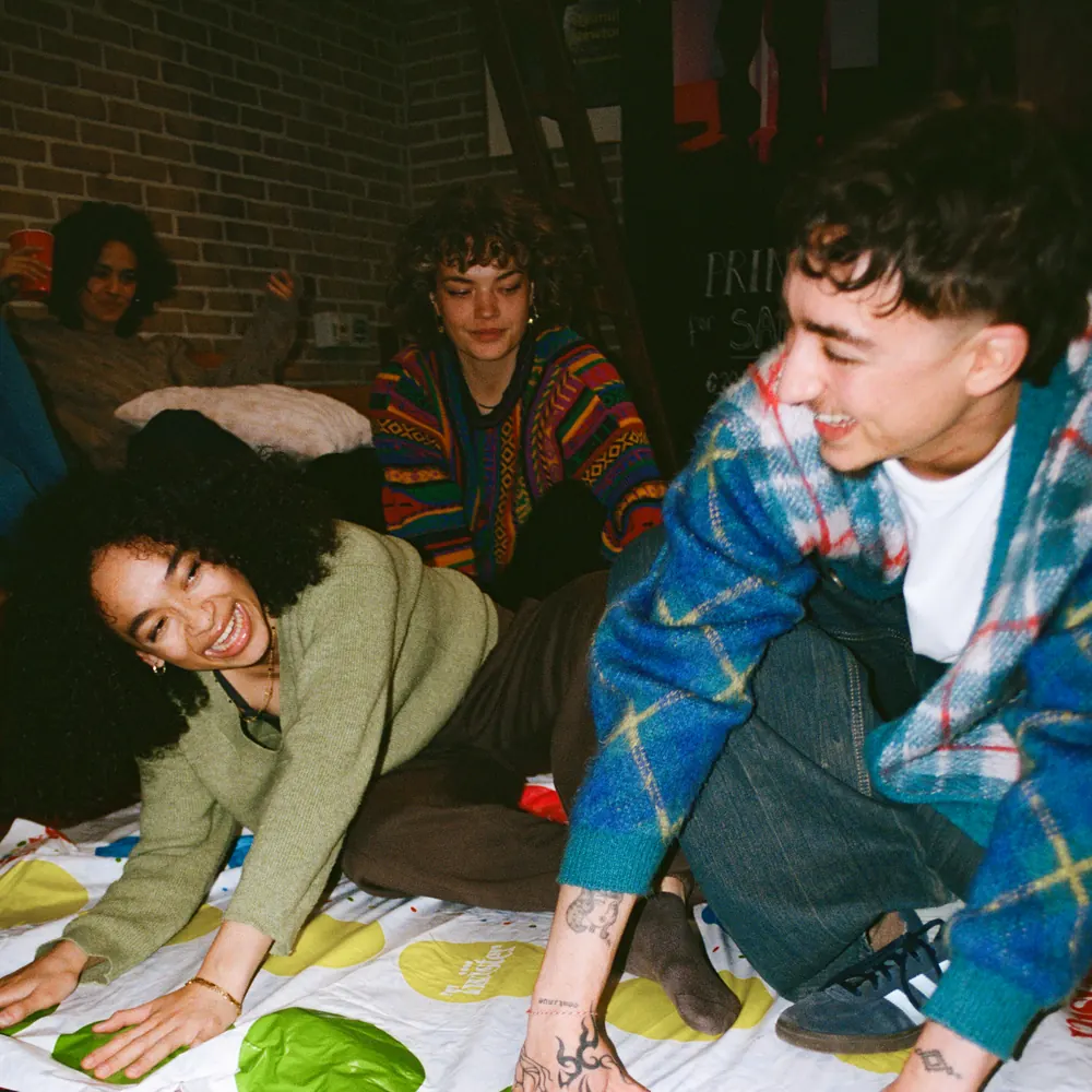 Friends splitting a bill with a shared Cino card