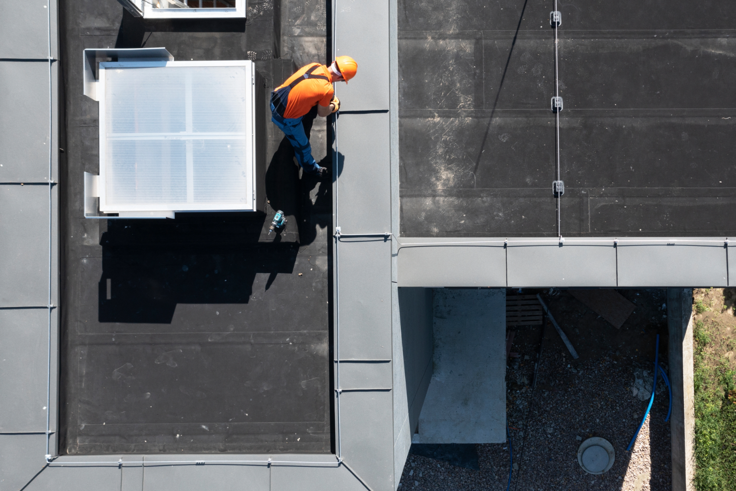 Roofer repairing roof in San Antonio.