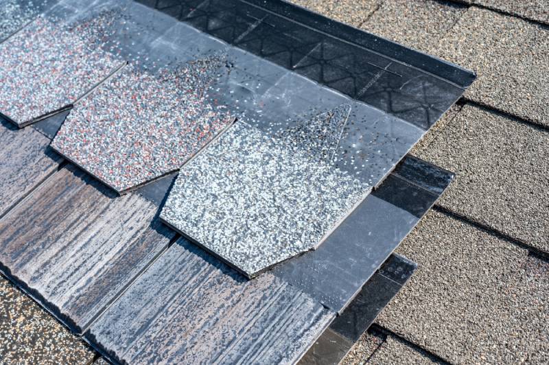 Asphalt shingle samples on a roof.