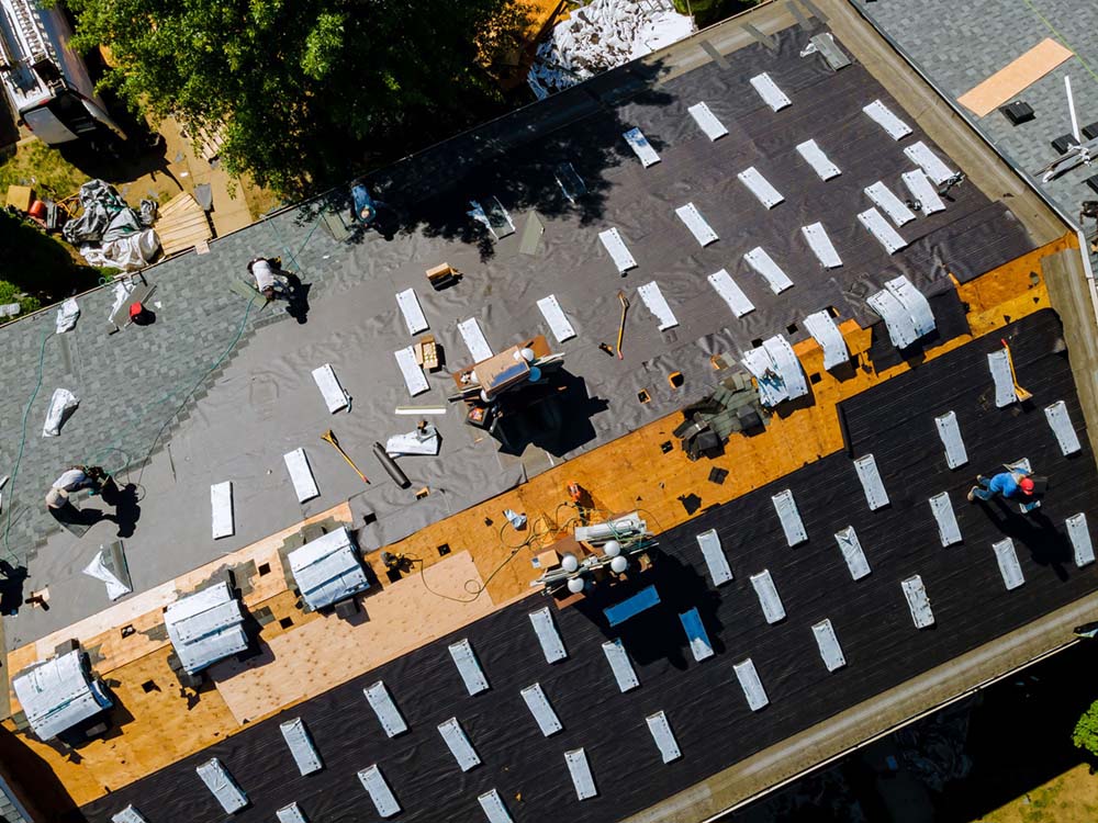 Aerial view of roof repair in progress.