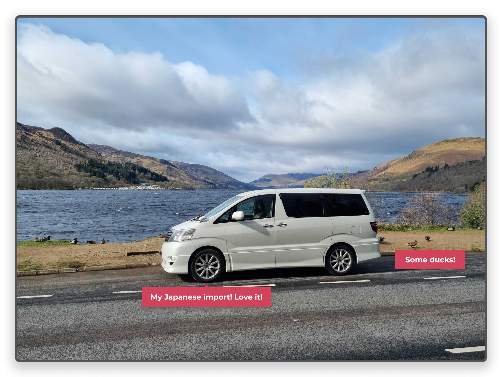 My white Japanese Toyota Alphard van sitting next to Loch Earn in Scotland