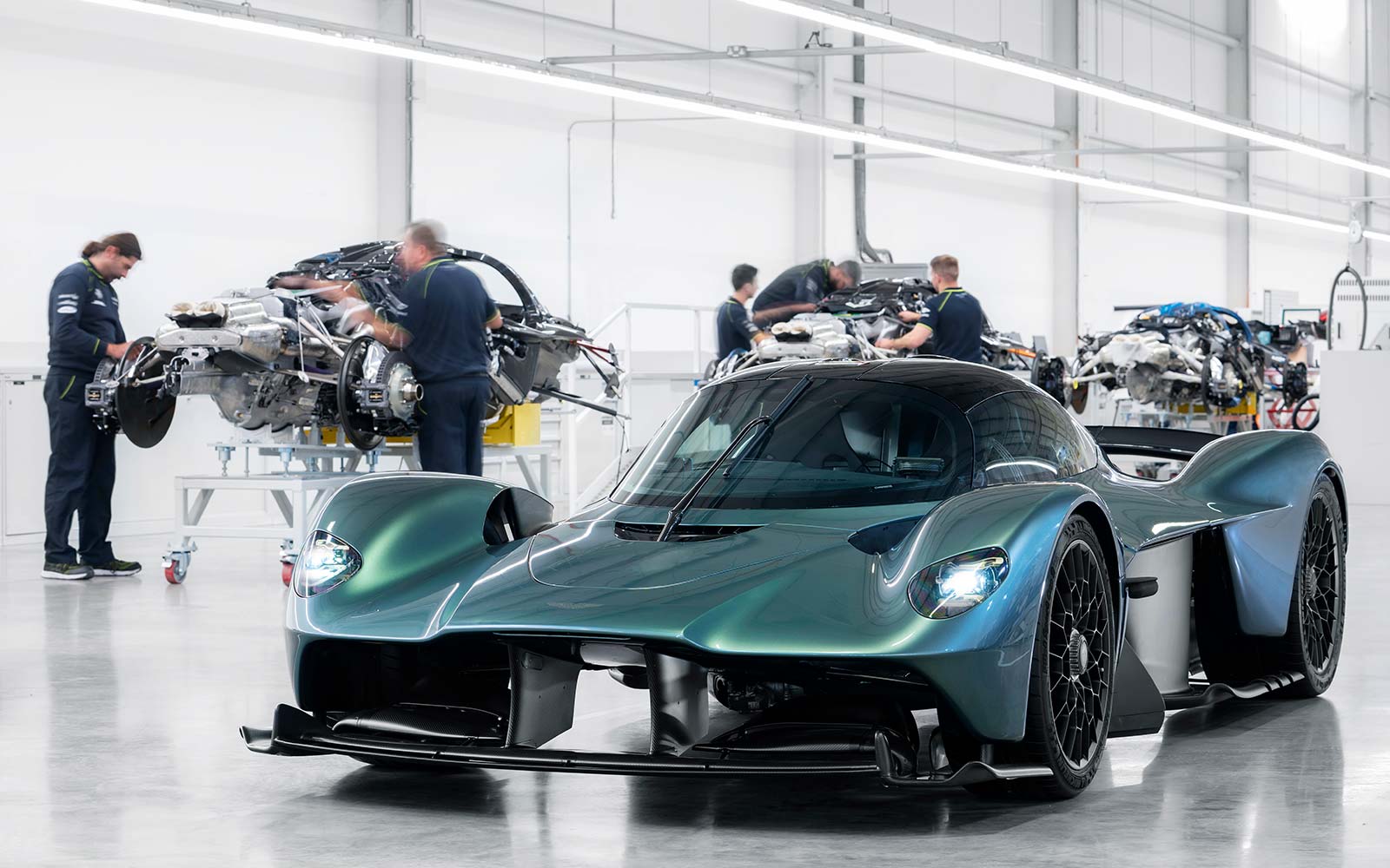 The production line for the hand-built Aston Martin Valkyrie, and one car complete and ready for its first customer.