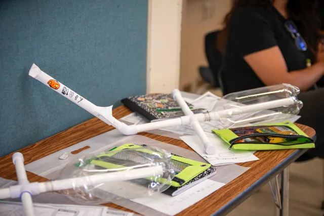 A group of people sitting at a table in a room.