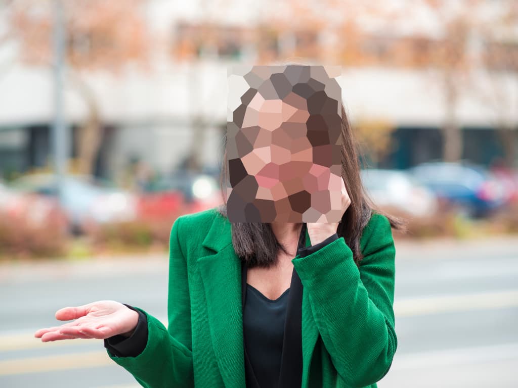 Woman's face being blurred out to protect her privacy