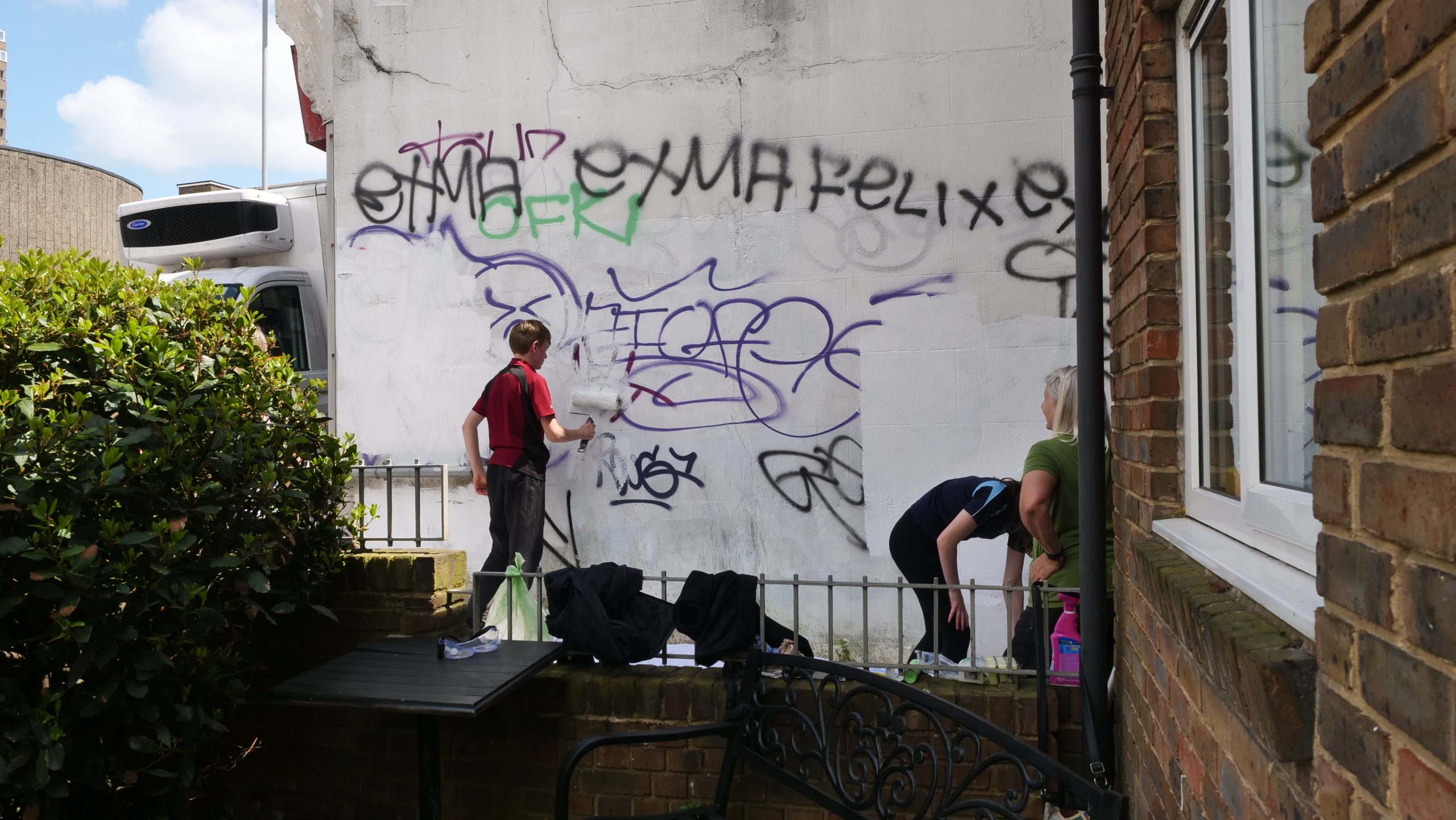 RMF Students Beautify Community by Painting Over Graffiti Russell