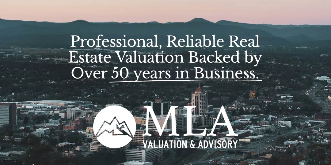 Cityscape with mountain silhouette in the background and text overlay stating 'Professional, Reliable Real Estate Valuation Backed by Over 50 years in Business.' below which is the MLA Valuation & Advisory logo featuring stylized mountains.