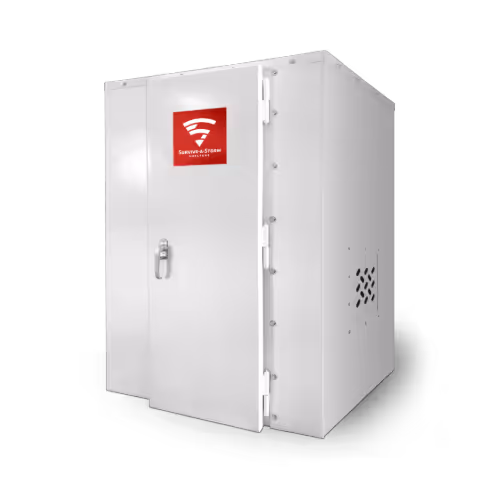 White metal storm shelter with a closed door featuring a red Survive-a-Storm logo.
