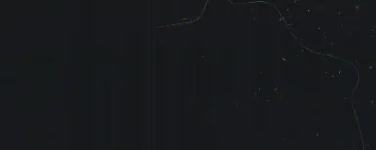 Close-up of a dark slate gray metal surface with subtle texture and light reflections.