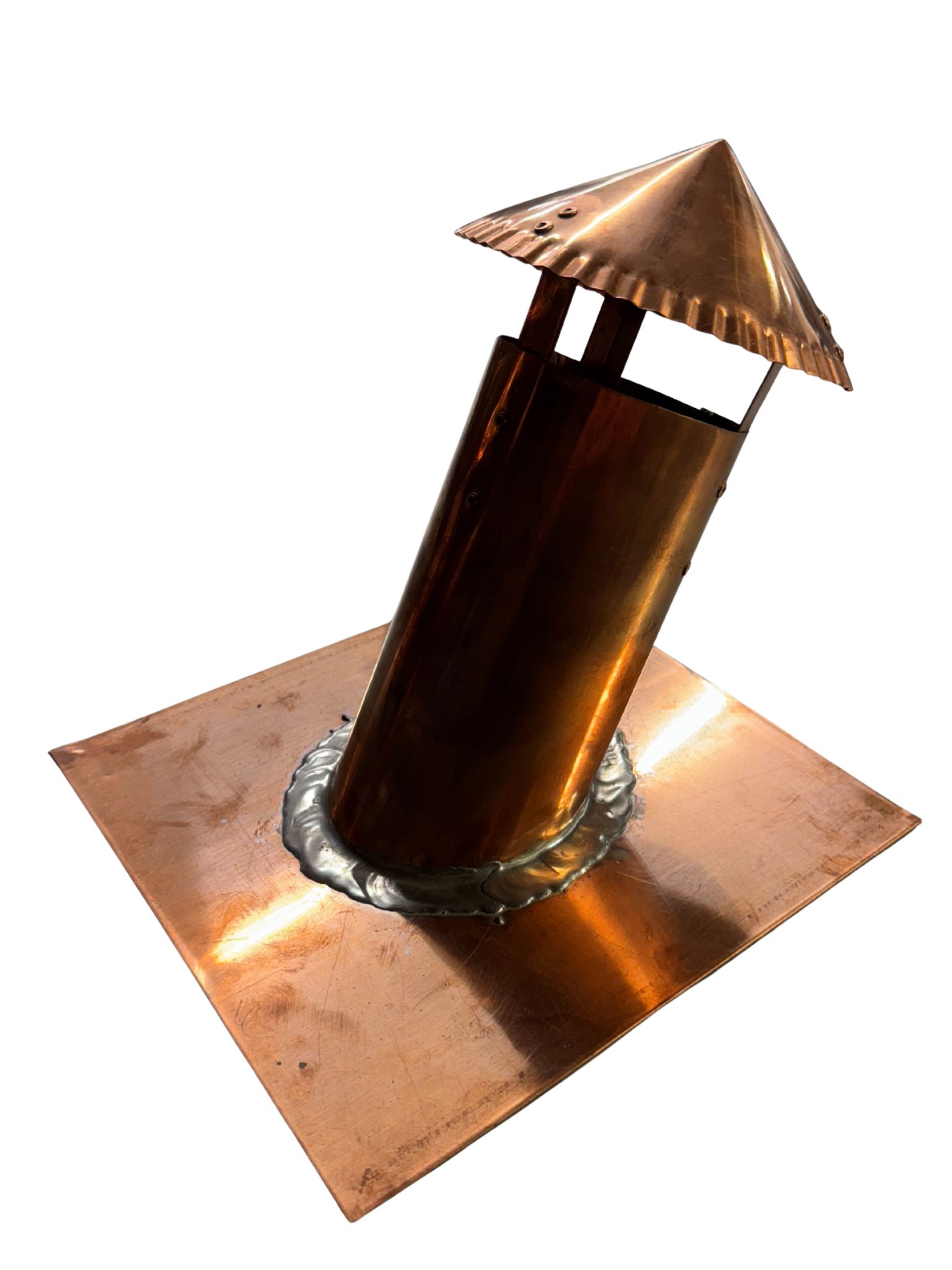 Copper chimney vent with a conical rain cap mounted on a square copper base plate.