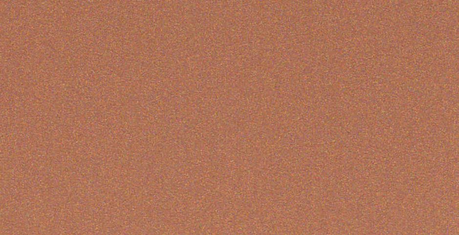 Texture of fine brown and orange granular surface with small scattered colored specks.