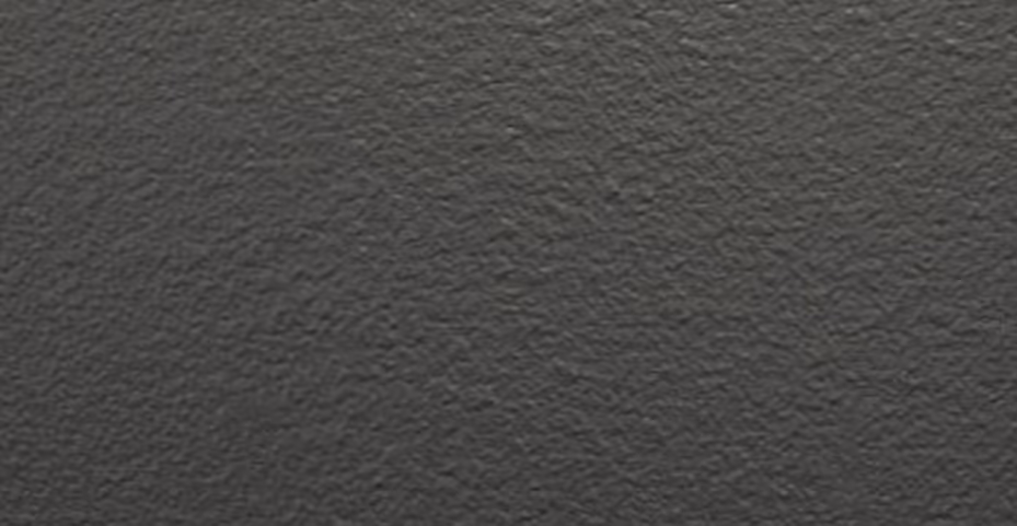 Close-up of a textured dark gray rough surface.