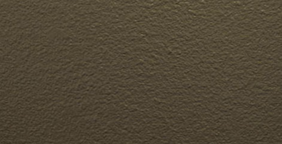 Close-up of a textured rough surface with an olive green color.