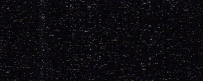 Close-up of black crinkle textured metal surface with small reflective specks.