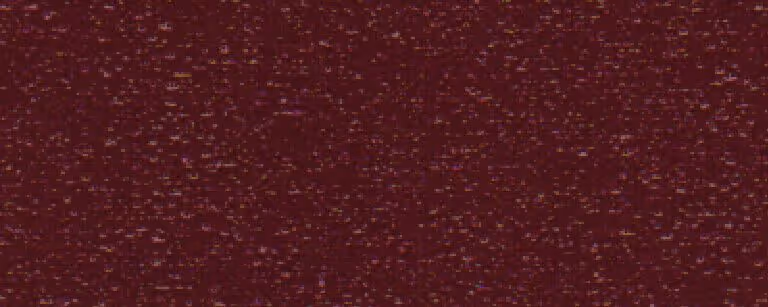Close-up of a dark red textured surface with small, scattered, irregular lighter spots.