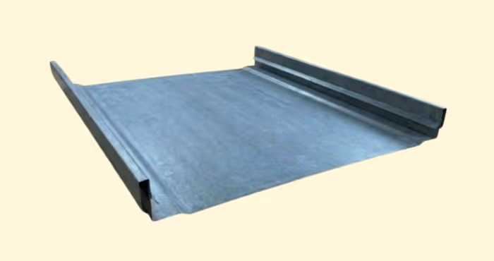 Gray metal roofing panel with raised edges on a pale yellow background.