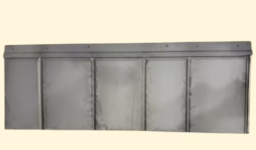 Gray metal panel with vertical ridges and a flat top edge, isolated on a beige background.