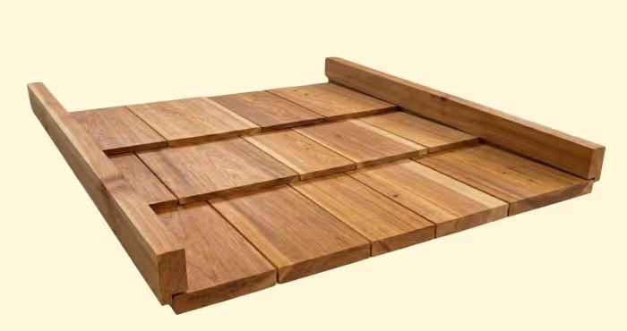 Wooden adjustable shower bench seat with slatted design and raised sides.