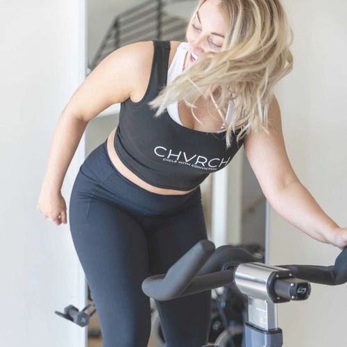 Riders on stationary bike in class