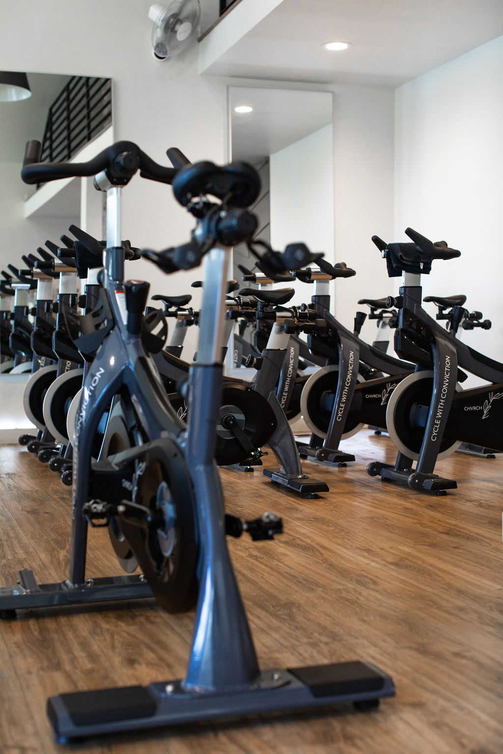 Riders on stationary bike in class
