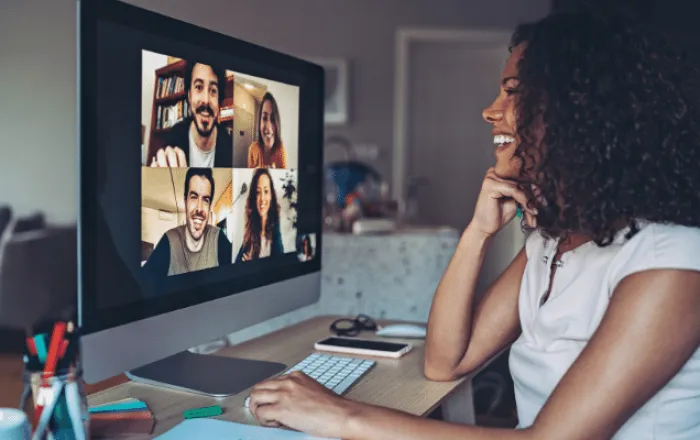 Woman showing signs of happiness because her company reinforces their culture daily on Kudos.