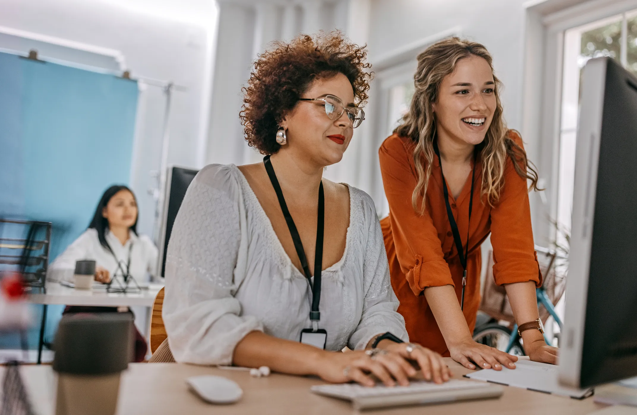 Colleagues weigh the pros and cons of different recognition programs together. Kudos is looking like the best option. 