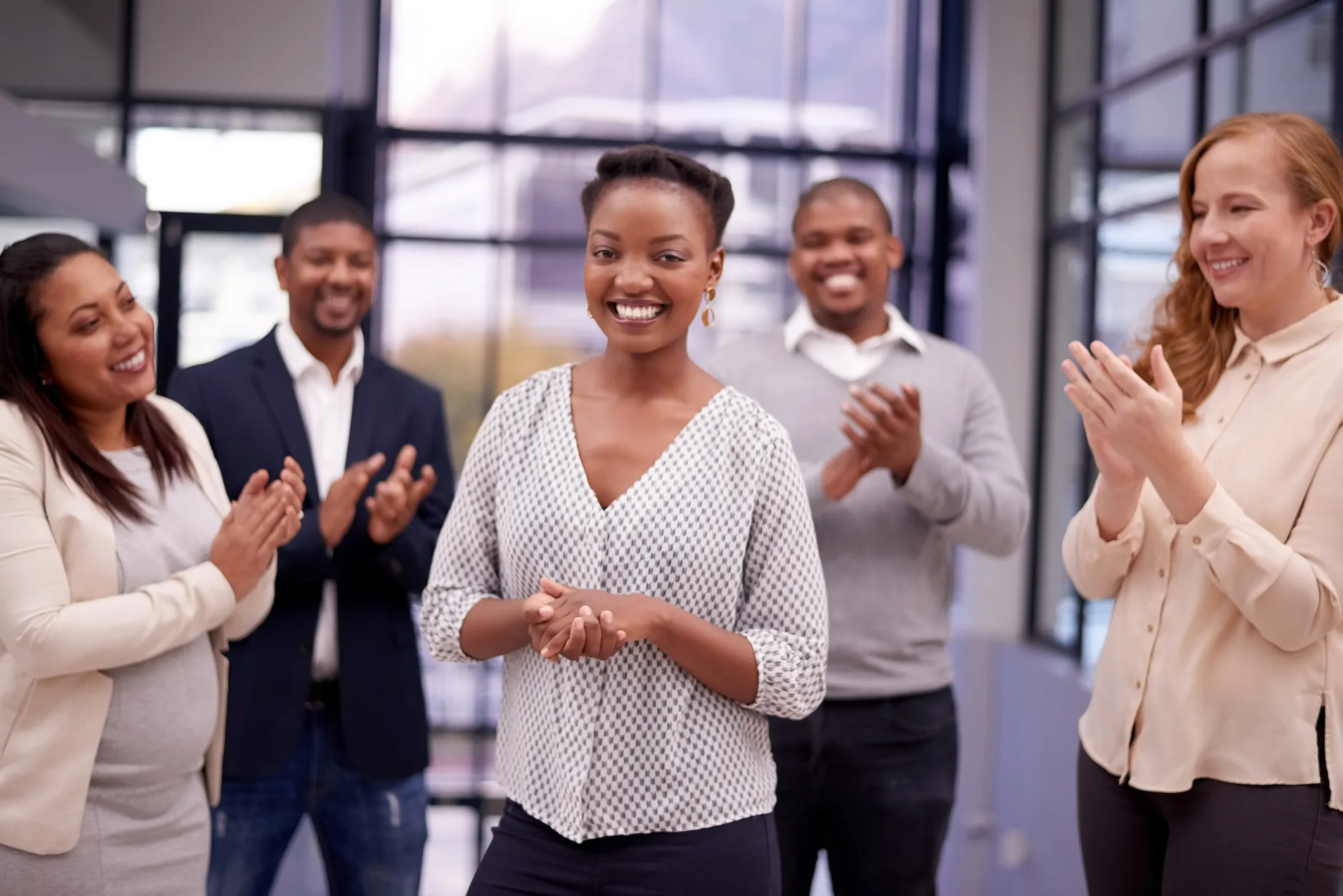 Woman receiving peer-to-peer recognition through Kudos for her work. The employee experience has never been more important.