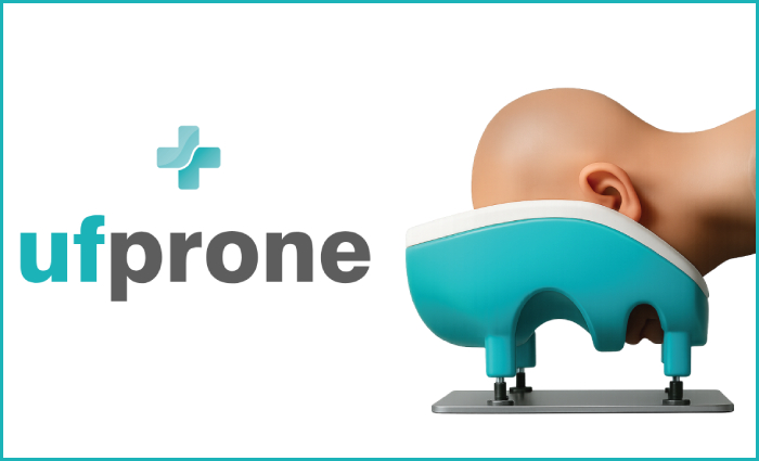 A bald human head and neck in the prone position being supported by a cushion and cradle system.