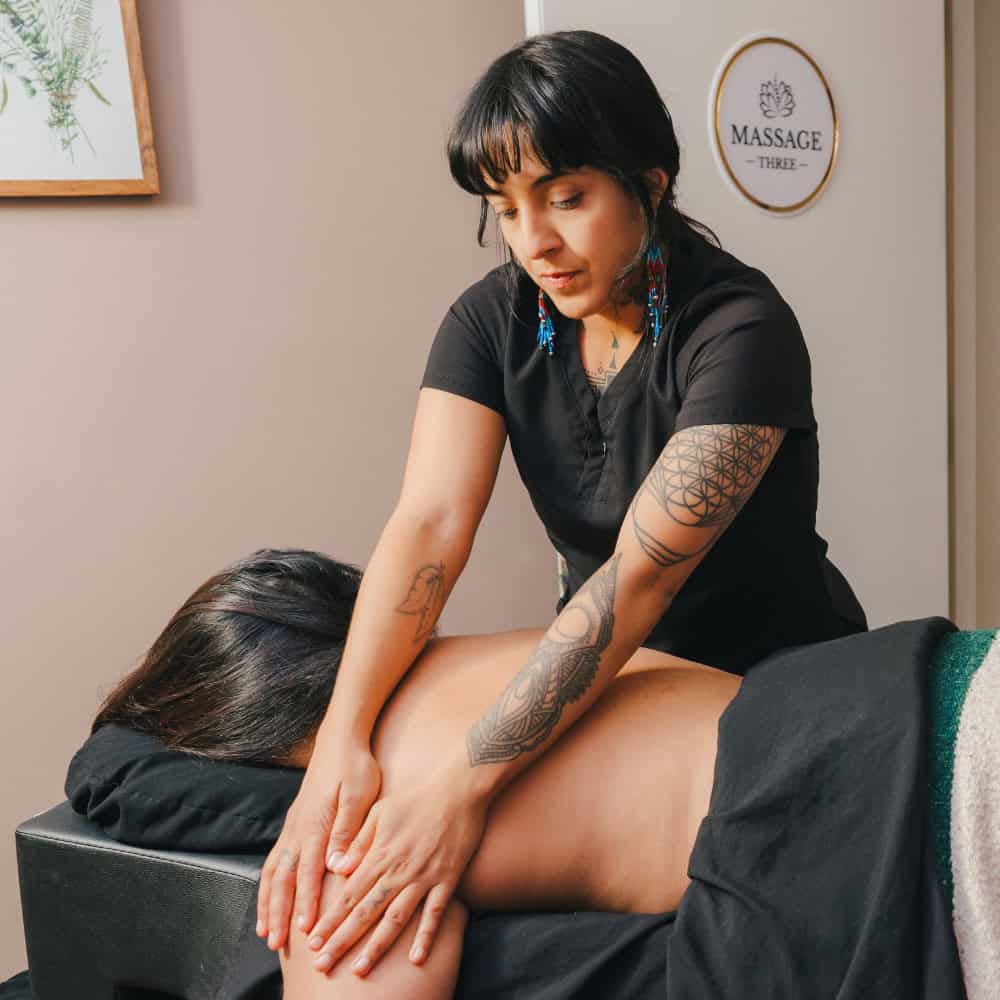 bixby knolls wellness center massage therapist give massage to woman