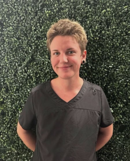 certified massage therapist Dayn Kerns smiling at camera