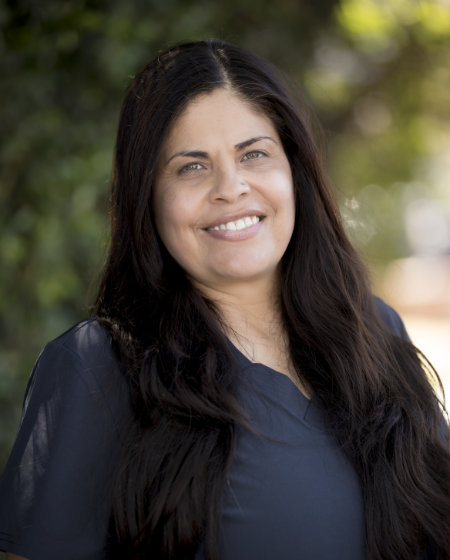 Massage therapist alejandra garcia smiling at camera