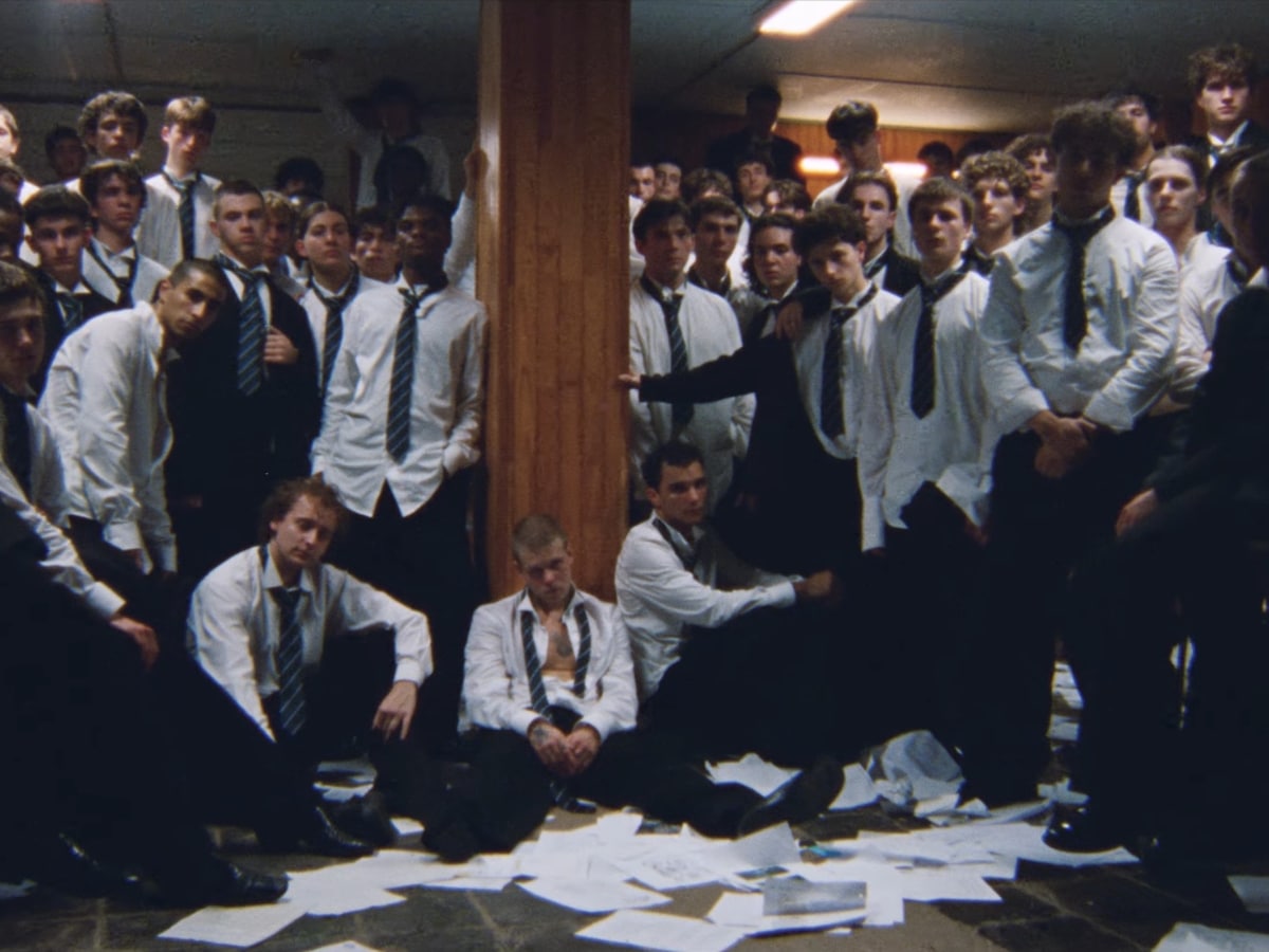 The choreographed mass movement of the boarding school students — still from STORM by GENER8ION (2026)