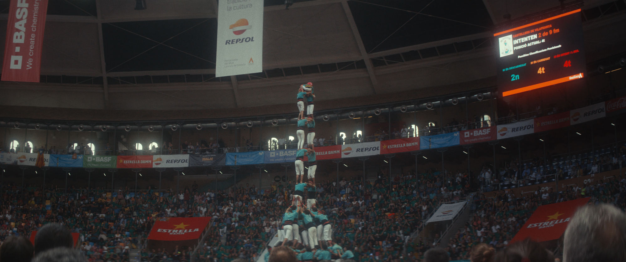 The castell human tower rising above the crowd — still from Castells by Autobahn (2019)