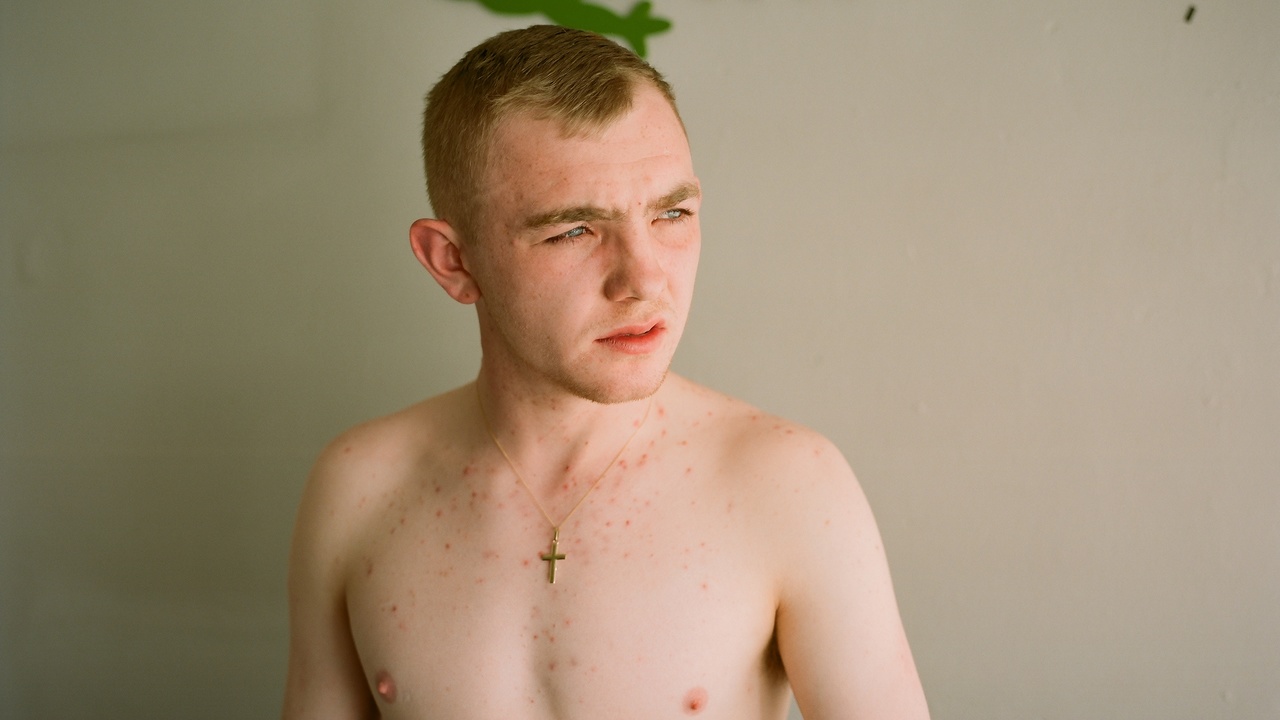 A teenage boy, shirtless, looking off to one side, still from Christy by Brendan Canty (2019)