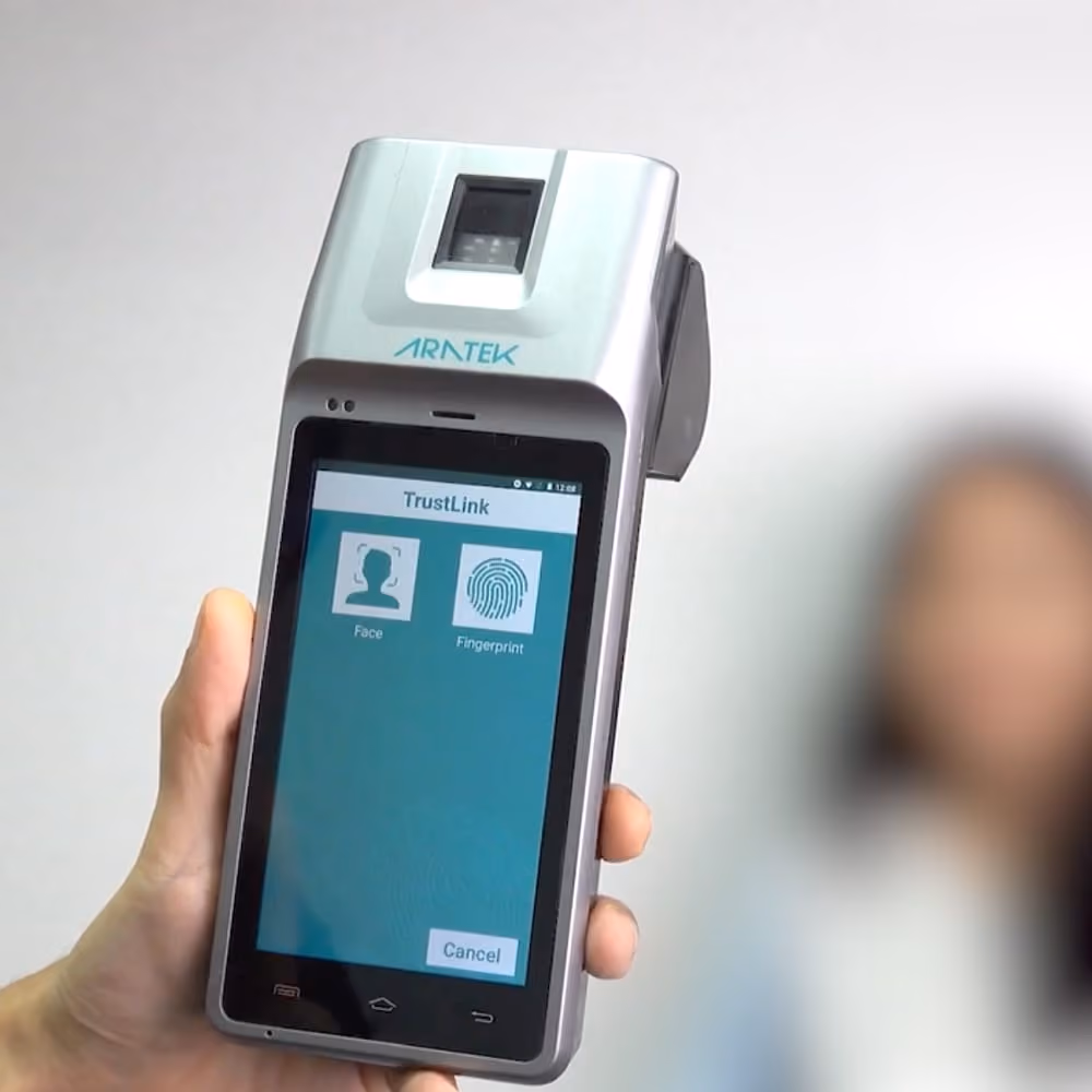 A man's hand held Aratek Marshall 5 biometric mobile device to check a woman's identity with fingerprint and face biometrics