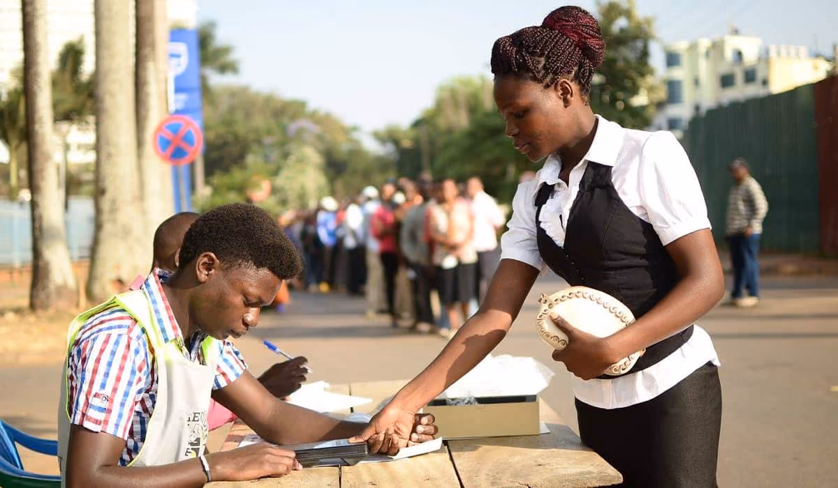 A biometric voter registration scene with fingerprint enrollment