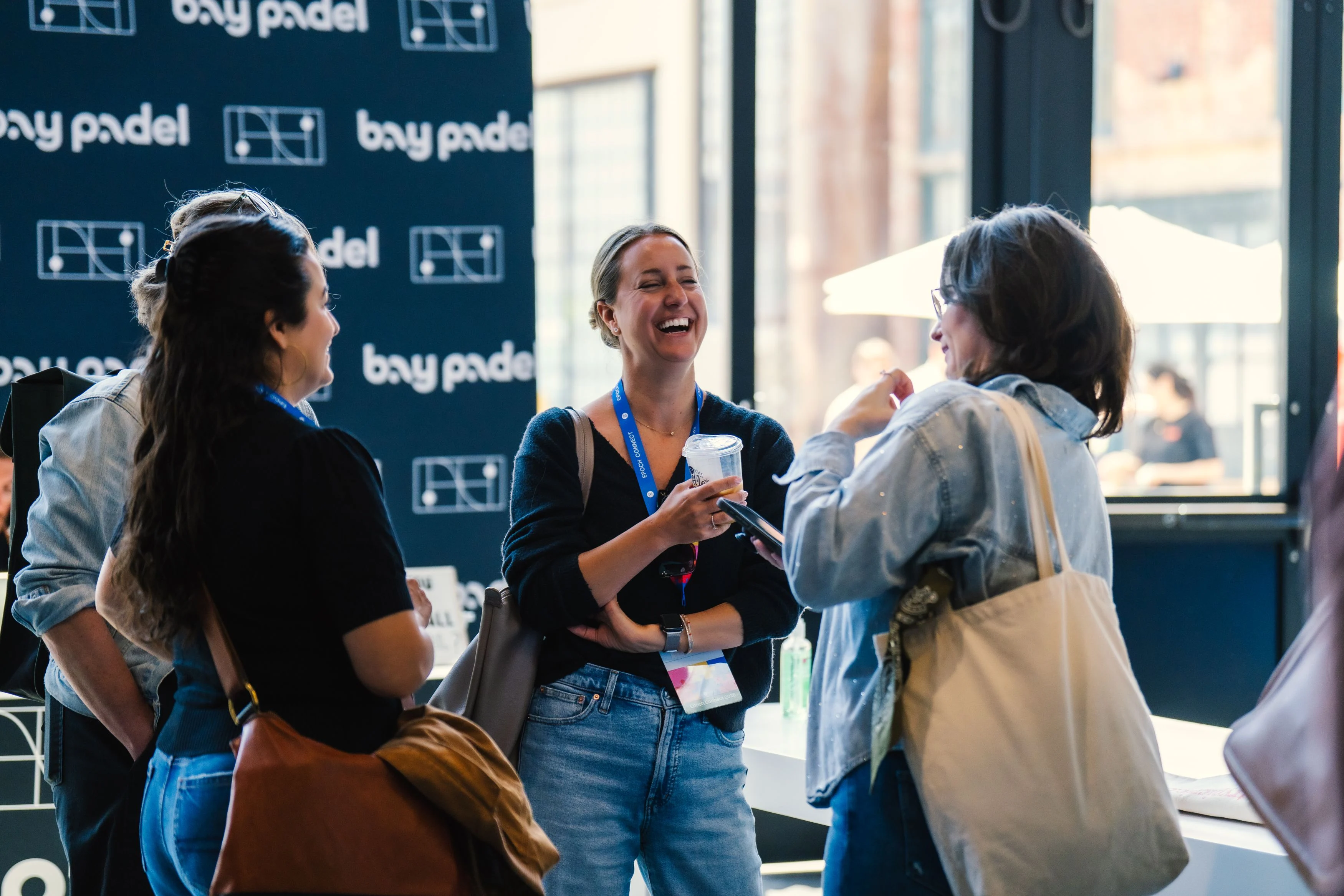 Employee smiling at an Epoch Engage event