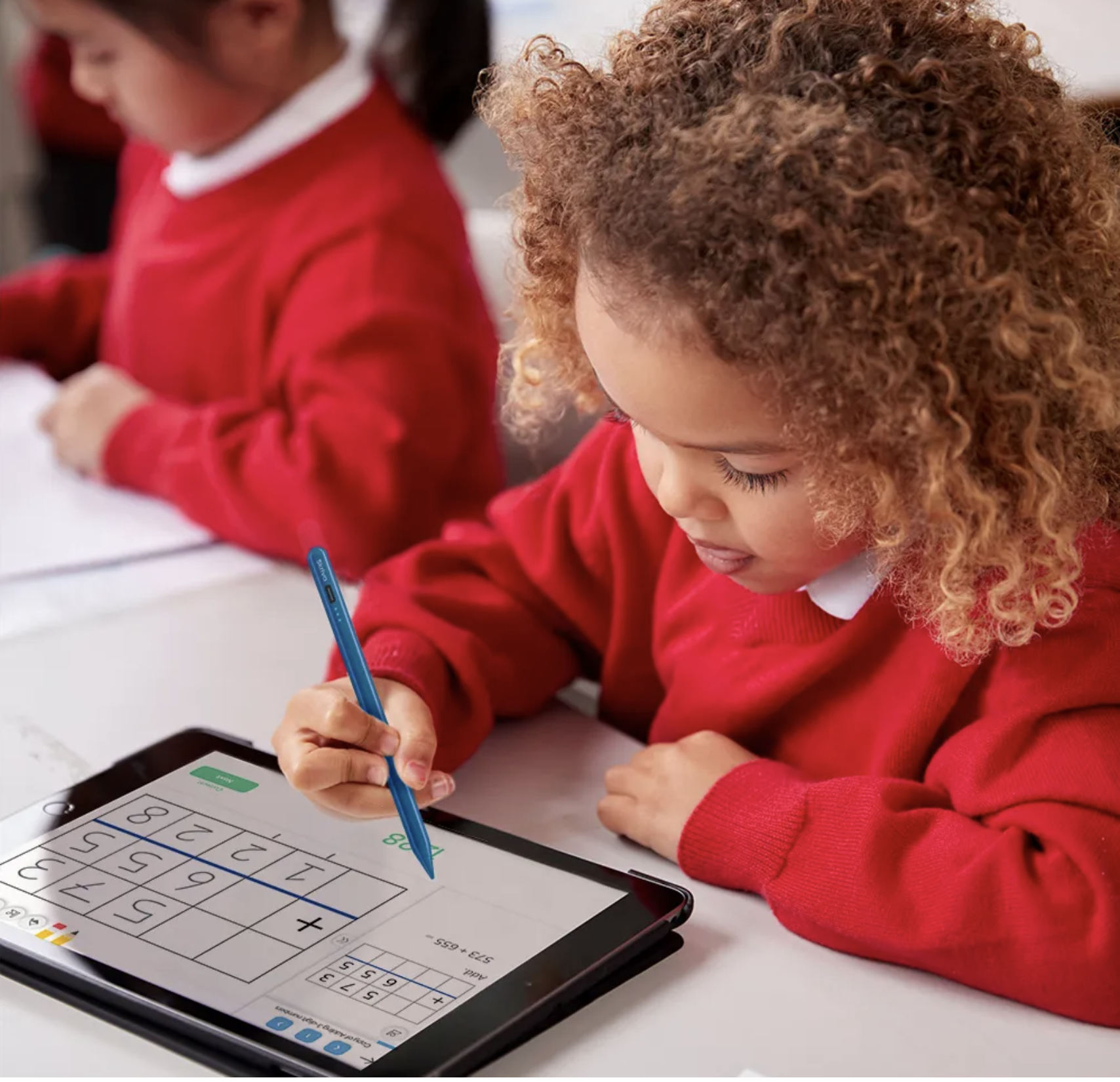 Young student in red sweater solving a math problem in Magma