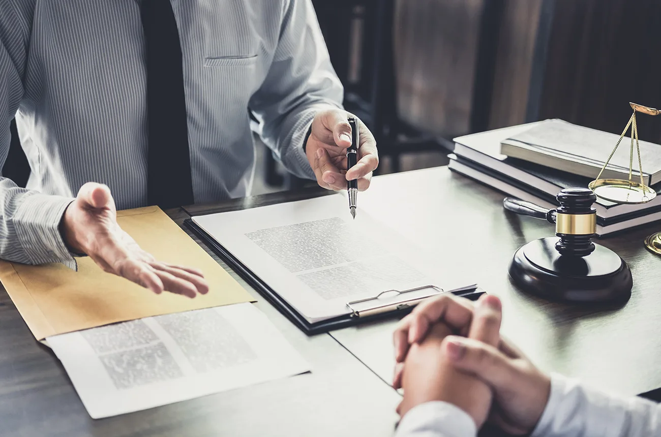 A client and lawyer discuss options in a workplace retaliation case.