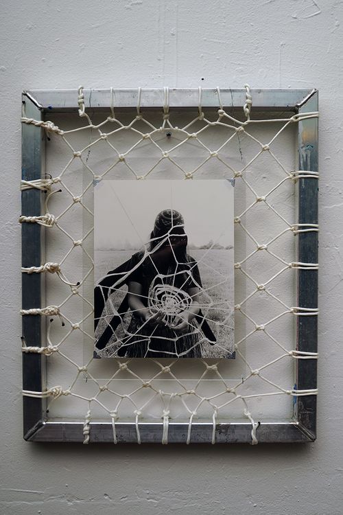 Spider Woman slings up a web.