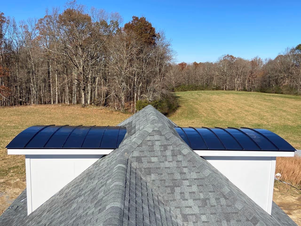 Curved Black Standing Seam Gables