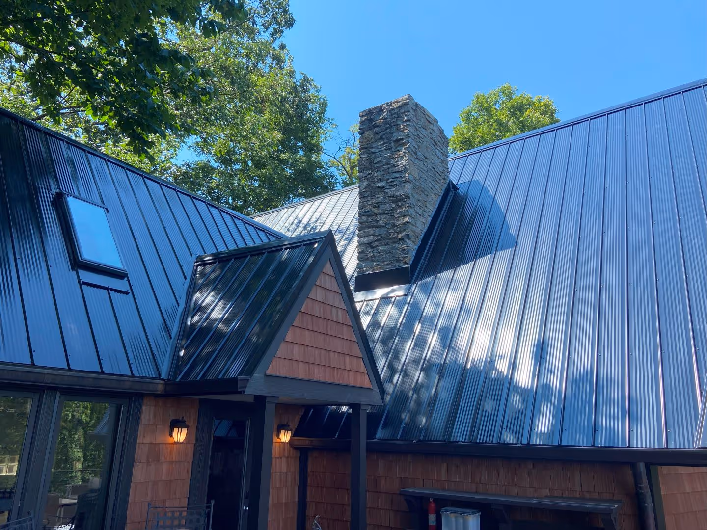 Mountainside Mid Century with a Black Classic Wave Metal Roof