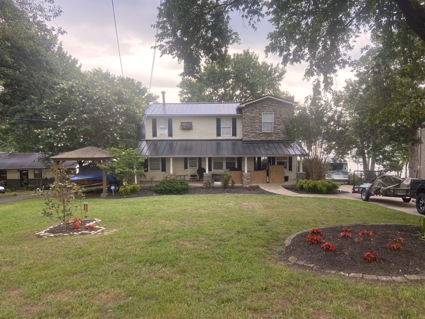 Black Standing Seam Lake House with Accent