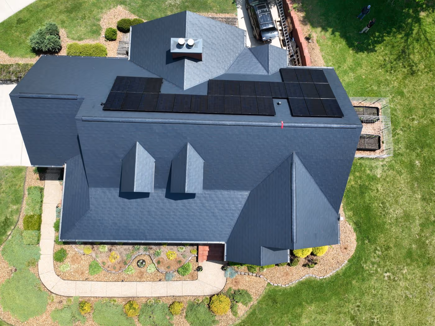Black Aluminum Shingle Roof With Solar Panel System