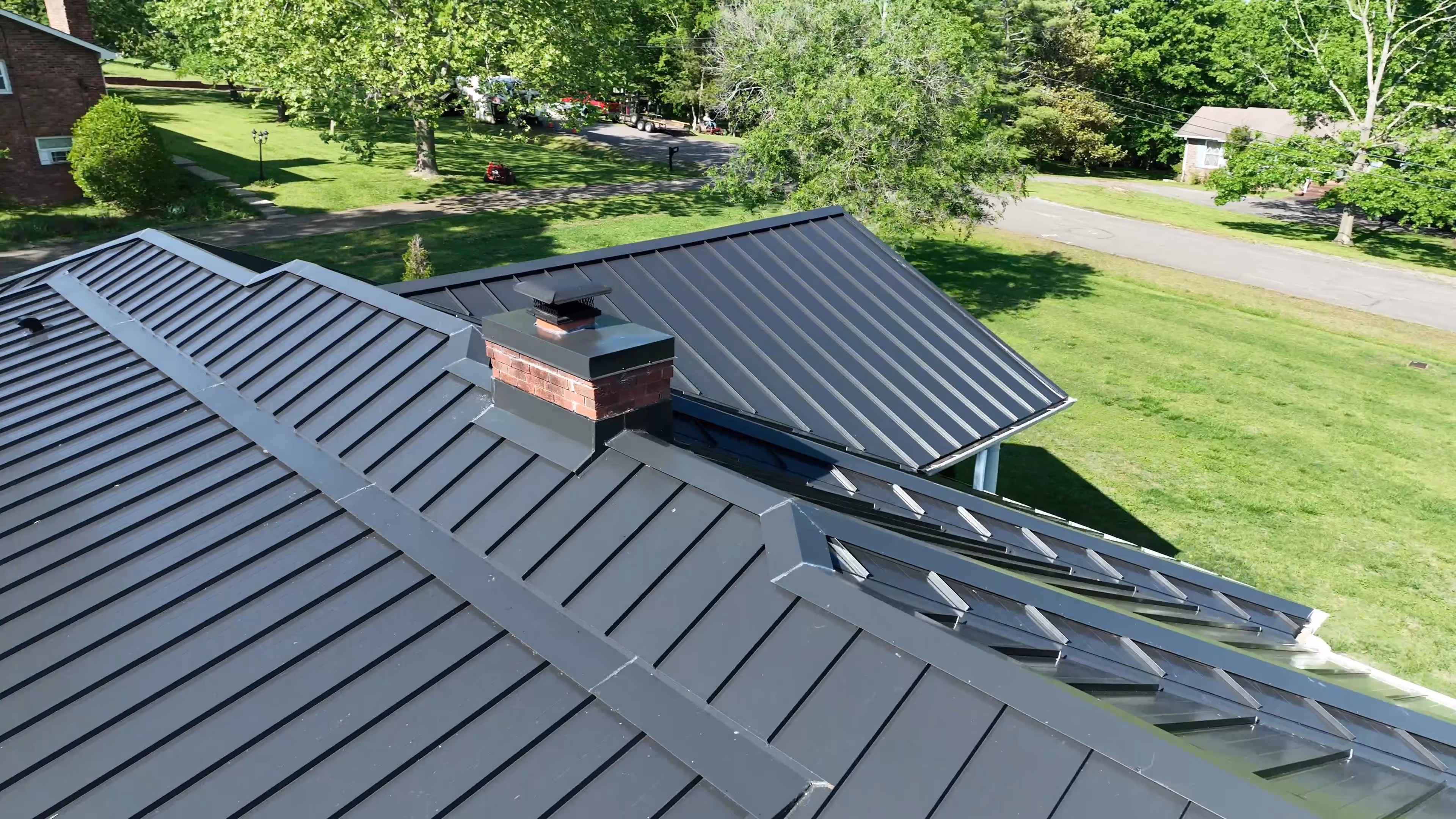 Black Standing Seam on Ranch Home With Pool