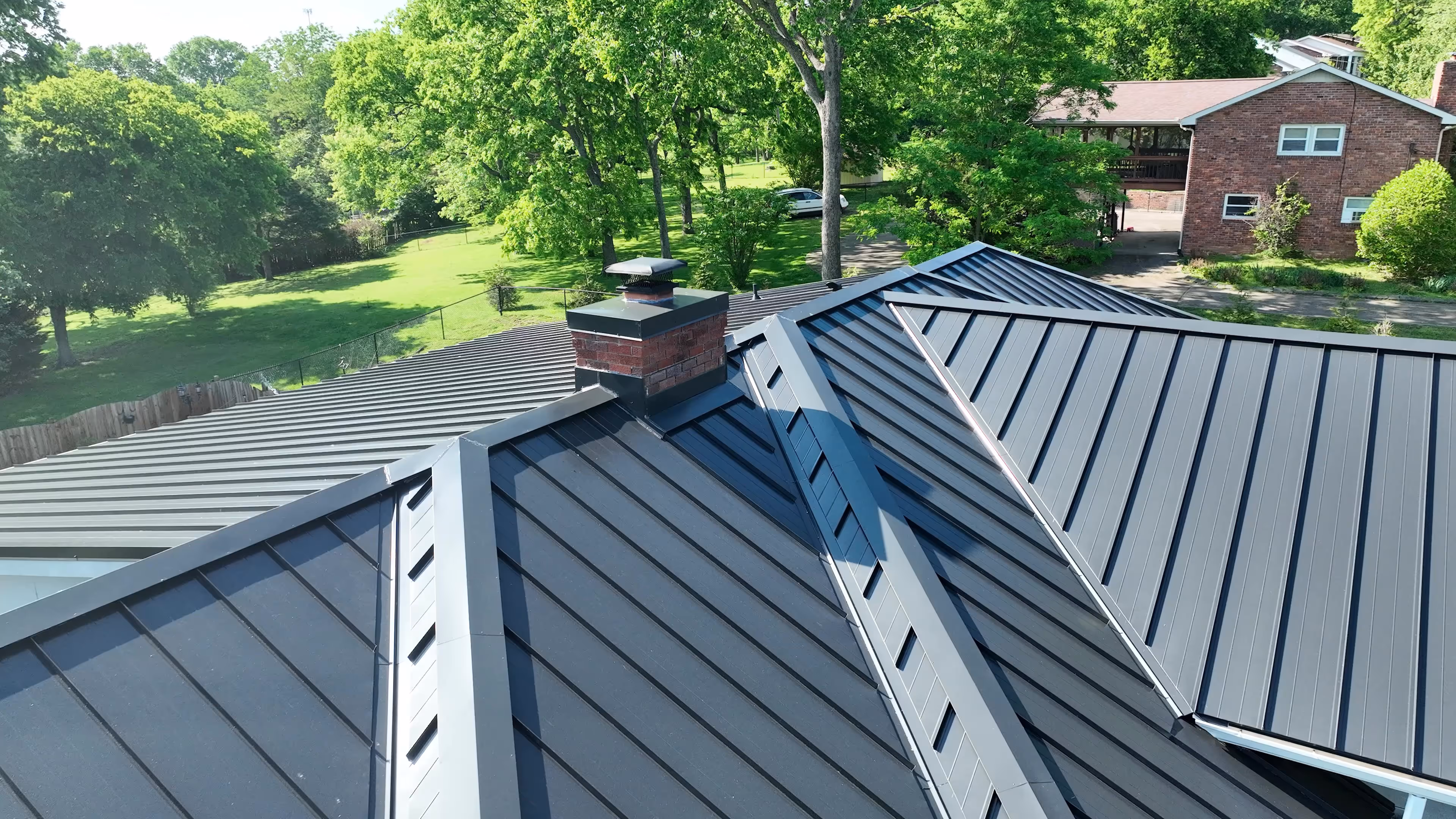 Black Standing Seam on Ranch Home With Pool