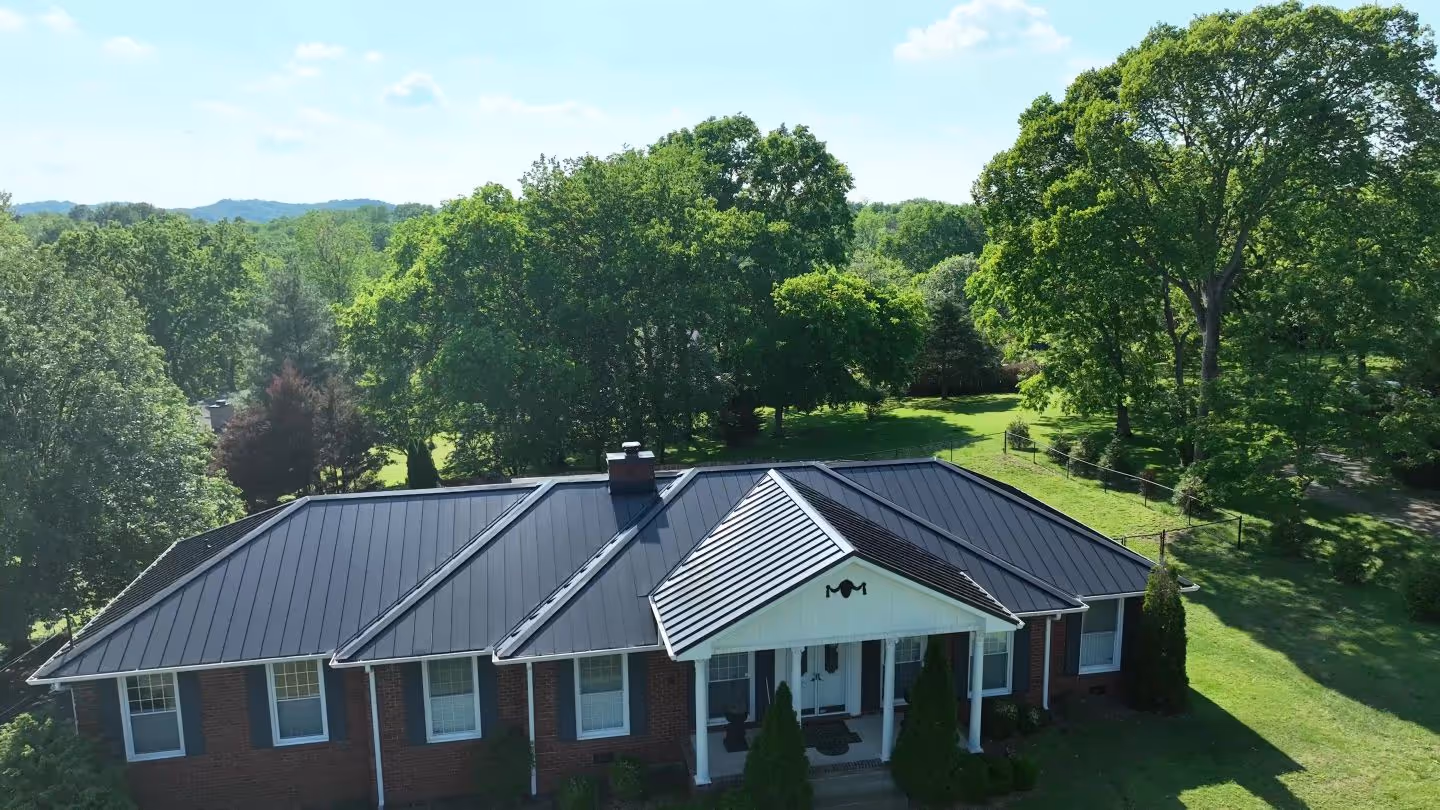 Black Standing Seam on Ranch Home With Pool