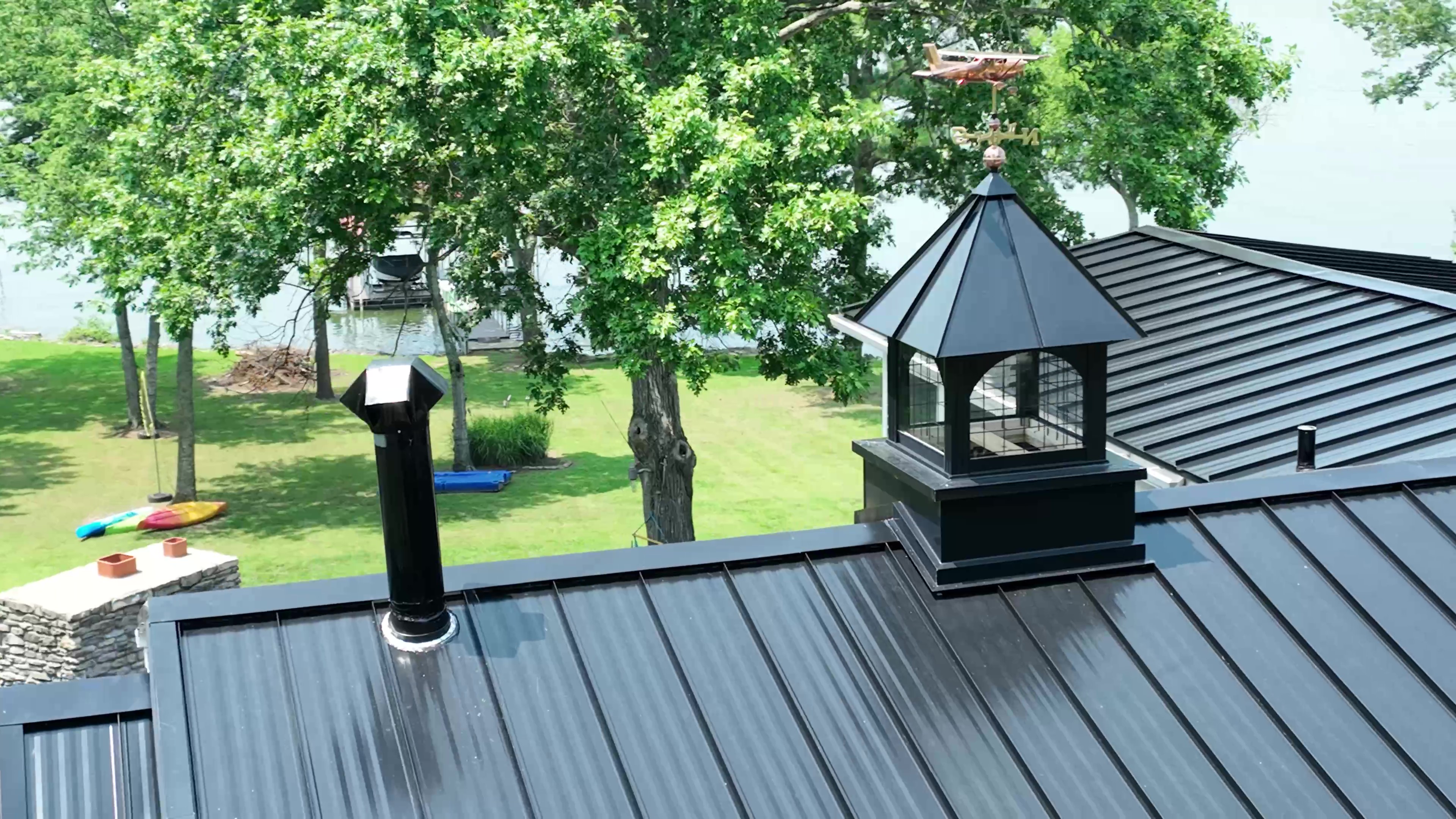 Nashville Lake House with Black Standing-Seam and Custom Chimney Caps