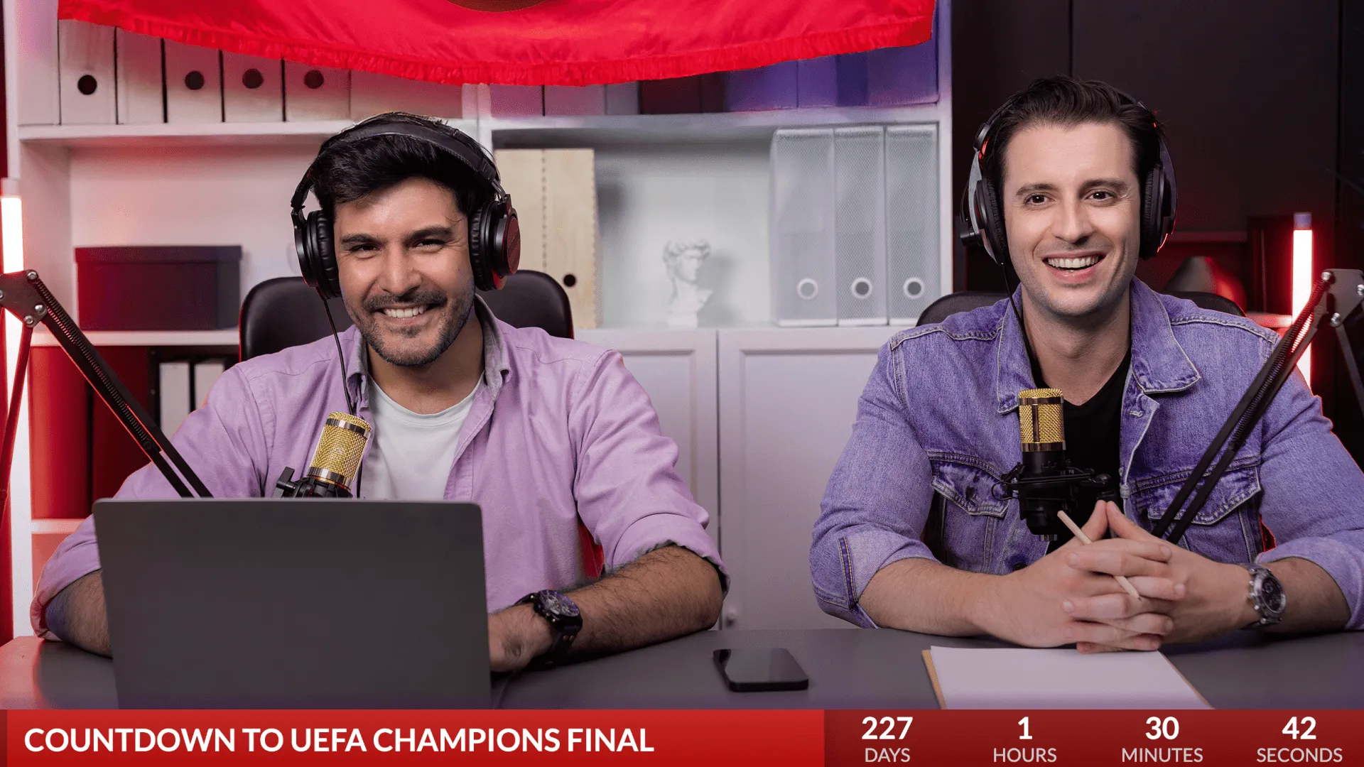 Two podcasters talking about soccer with a soccer countdown overlay counting down to championships.