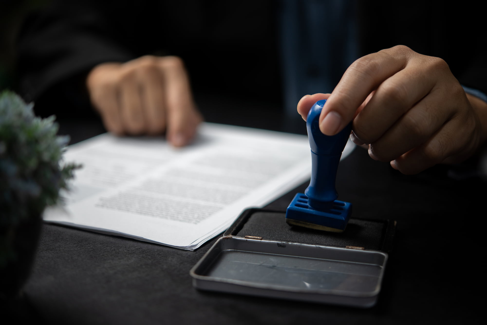 Man stamping a notarized document